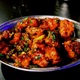The manchurian-style preparation of chicken or vegetables is now found in almost every Chinese restaurant in India.